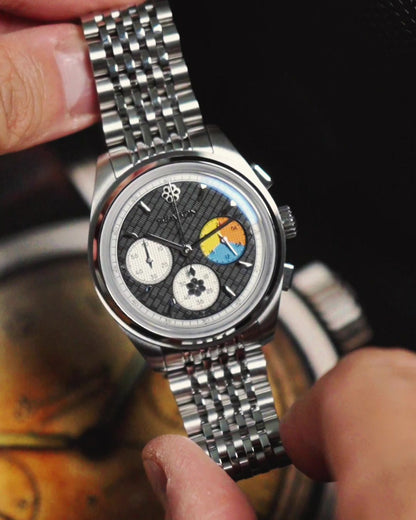 Season #2 Trinity held in hand, showing 39mm case size on steel bracelet